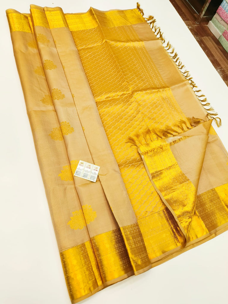 Pure Kanchipuram Silk Saree Beige with designs all over the body and Golden Zari Border
