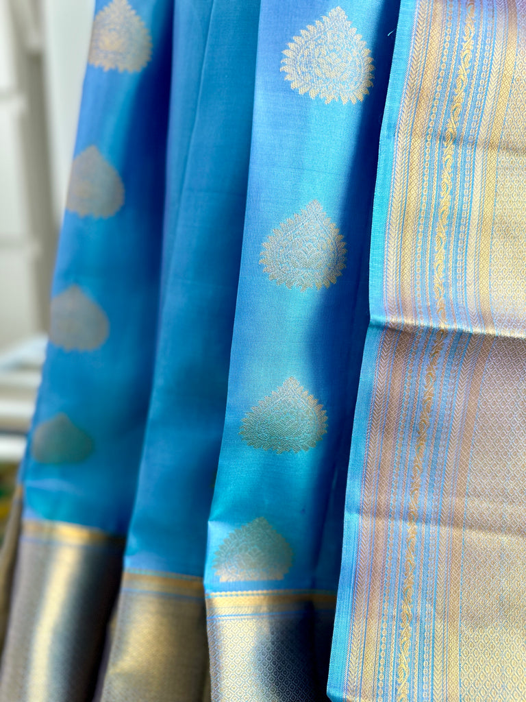 Pure Kanchipuram Silk Saree Blue with designs all over the body and Long Golden Zari Border