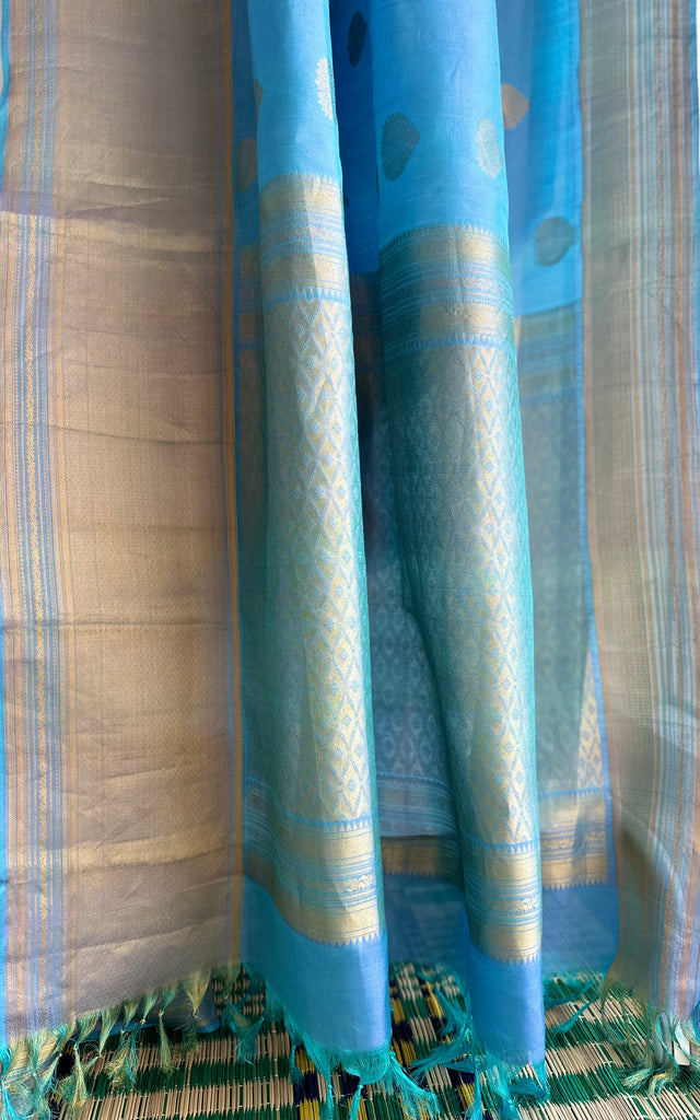 Pure Kanchipuram Silk Saree Blue with designs all over the body and Long Golden Zari Border
