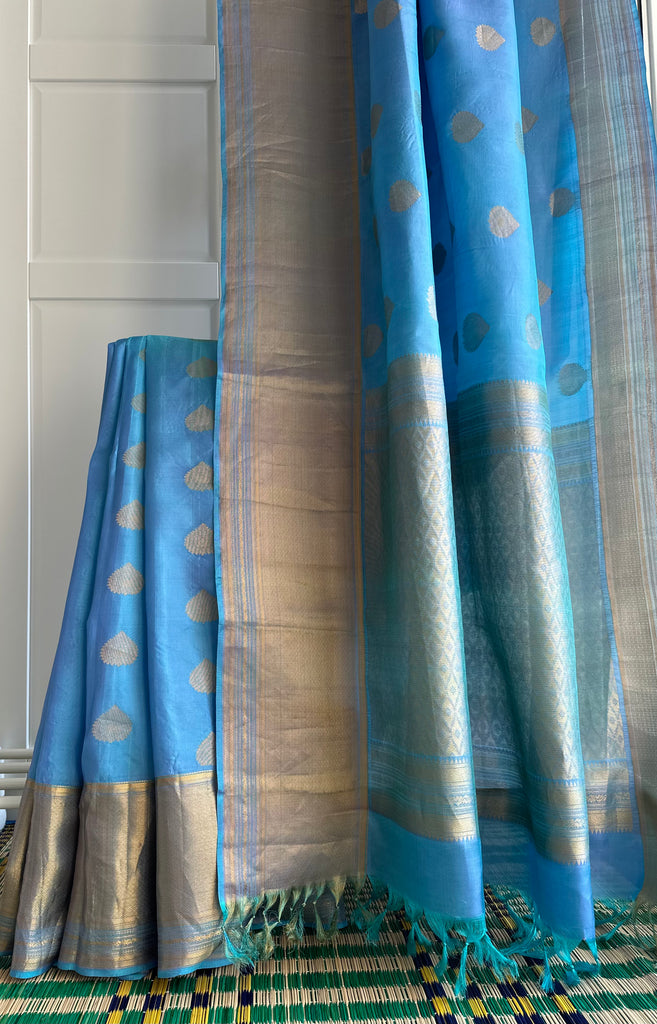 Pure Kanchipuram Silk Saree Blue with designs all over the body and Long Golden Zari Border
