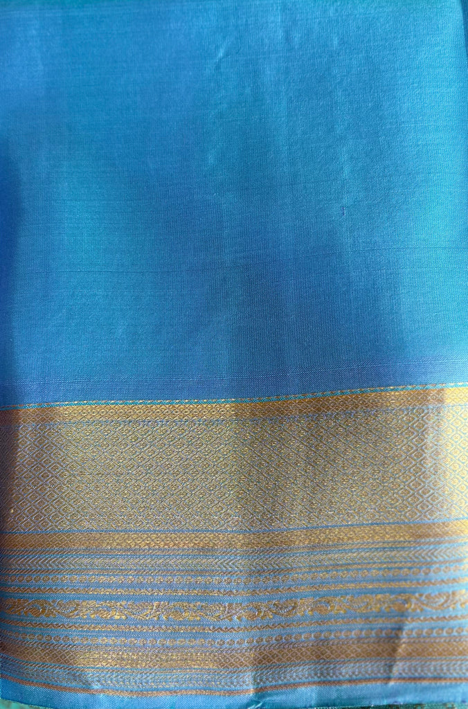 Pure Kanchipuram Silk Saree Blue with designs all over the body and Long Golden Zari Border