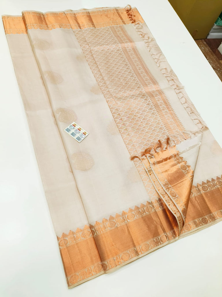 Pure Kanchipuram Silk Saree White with designs all over the body and Copper Zari Border